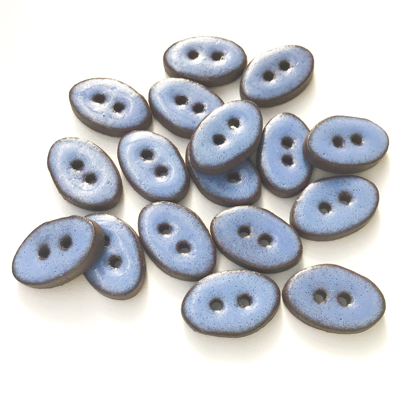 Blue Oval Clay Buttons on Black Clay - 1/2" x 3/4"