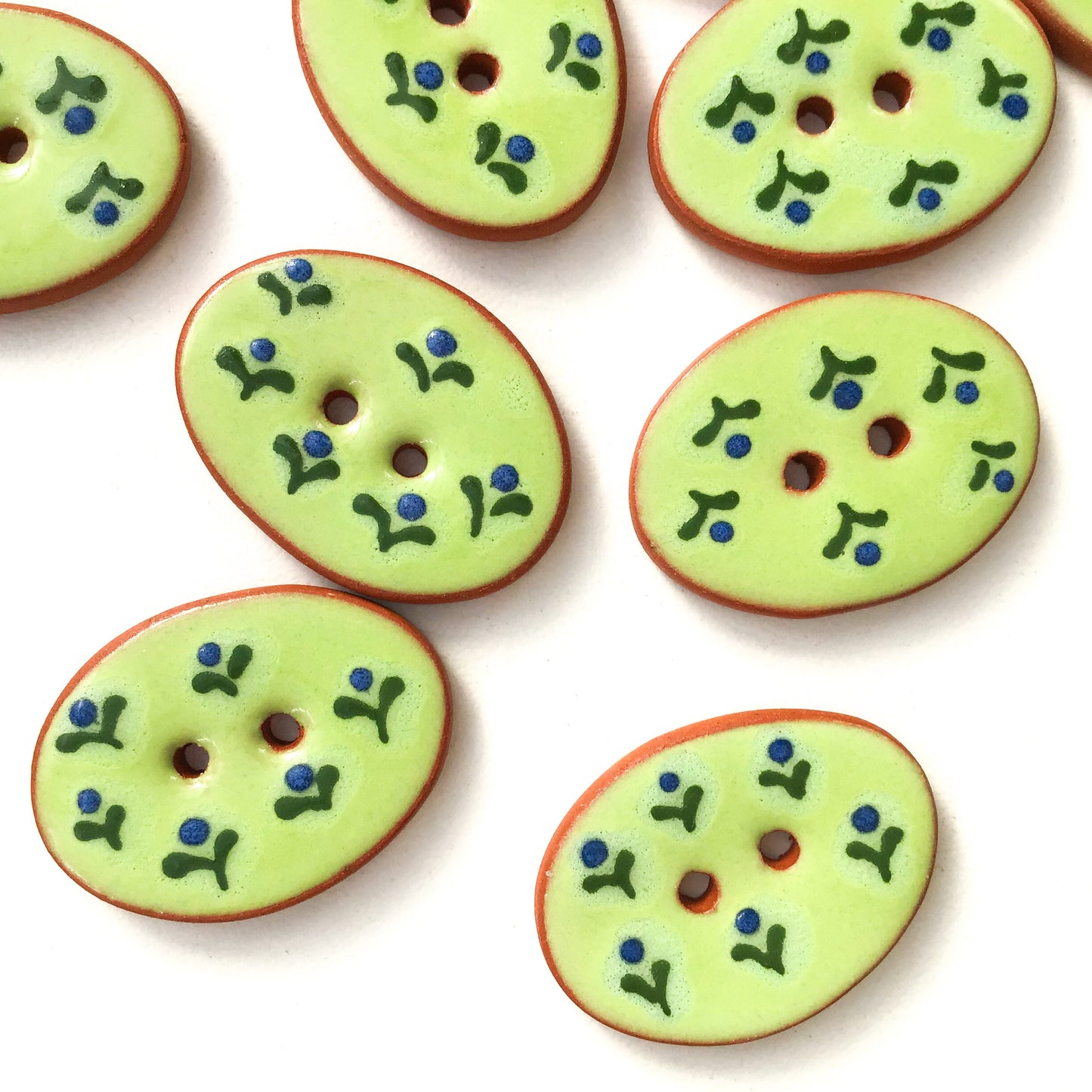 Green Ceramic Buttons with Small Blue Flowers 3/4" x 1-1/16"